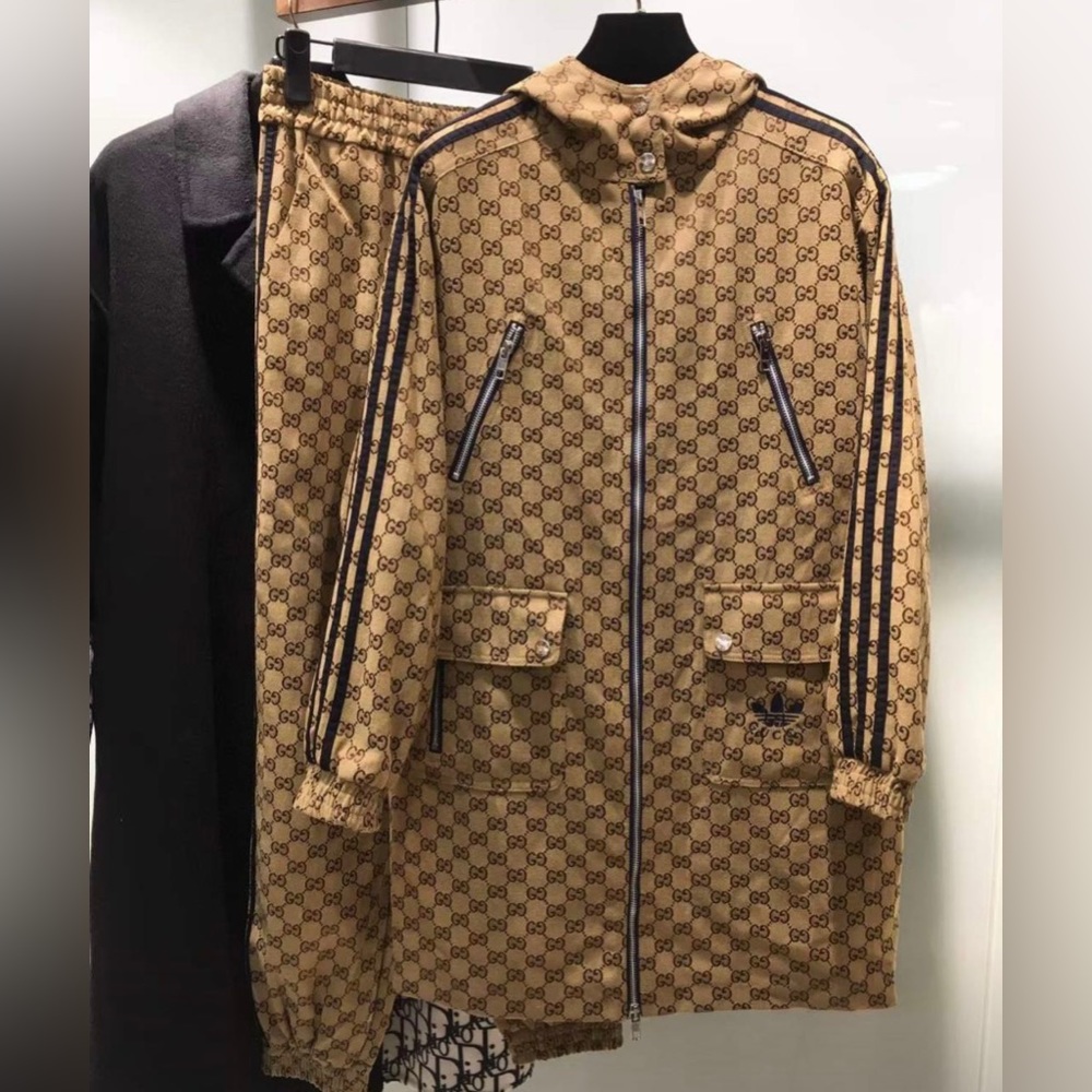 2 piece suit.  Coat and pants. With tags. Looks like gucci style.